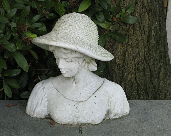 Bust_sculpture_of_a_woman_on_a_grave_in_Amsterdam by Natalie Maynor Cherokee by Mela