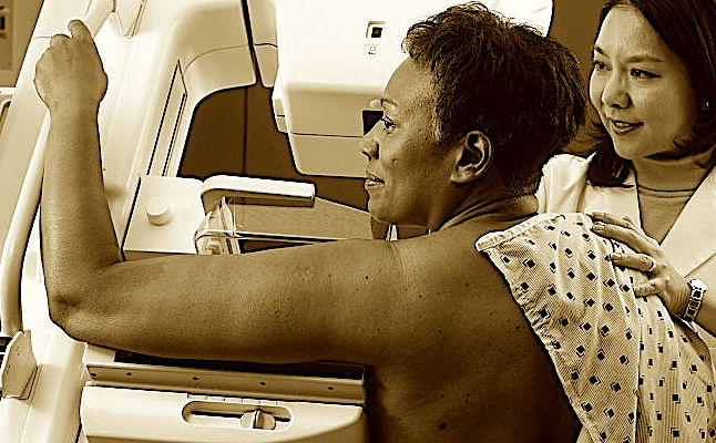 750px-Woman_receives_mammogram